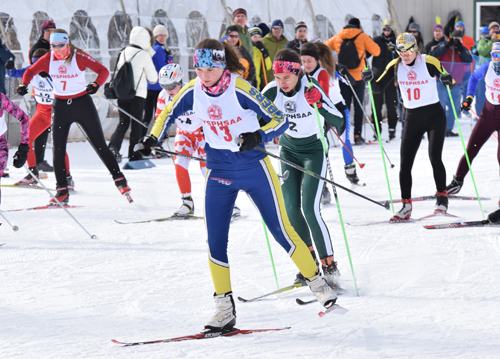 Nina Armstrong (center) competes in the 2015 NYSPHSAA nordic championship meet at Mount Van Hoevenberg in Lake Placid. Photo: ADK Enterprise
