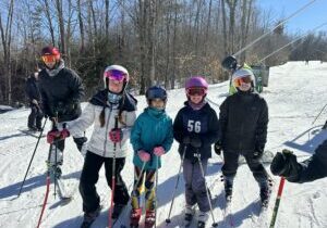 group of kids on skis